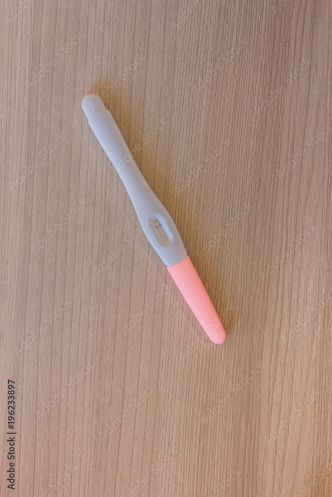 Negative pregnancy test over the table. Negative pregnancy test over the table.