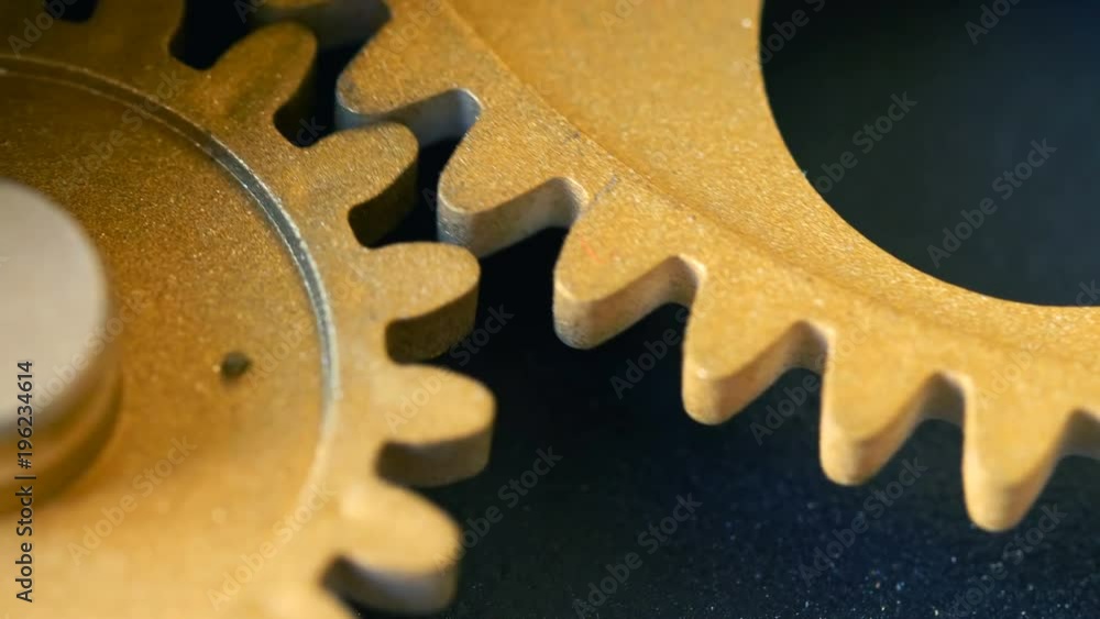 close up on mechanism wheels spinning together- concept close up on mechanism wheels spinning together- concept