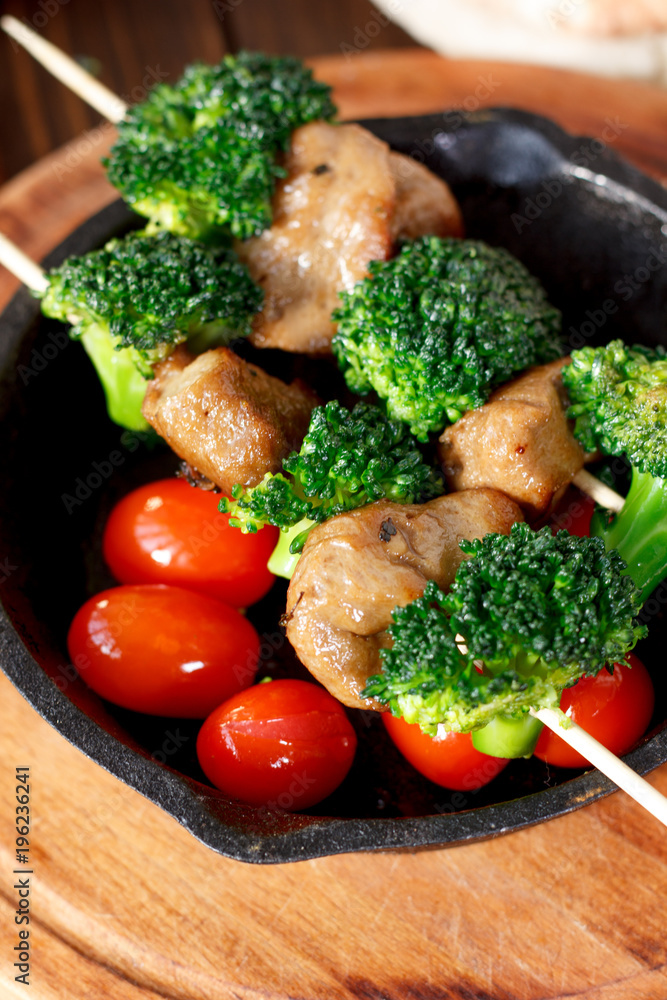 Vegetarian kebabs with seitan and broccoli on a skewers.