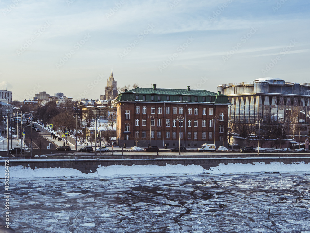 moscow winter embankment street and frozen ice river