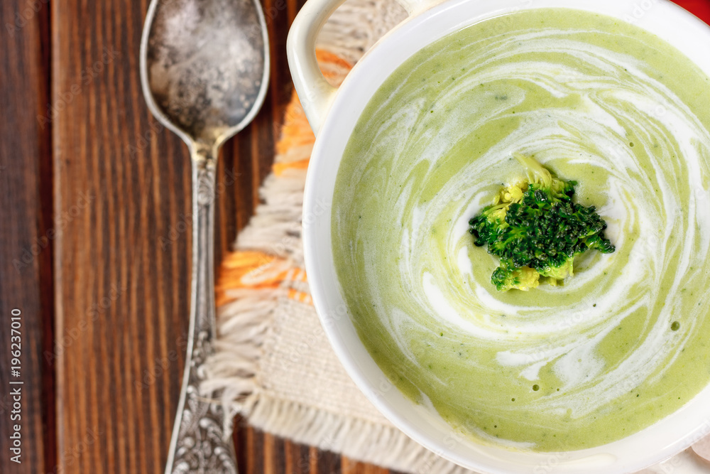Beautiful vegetarian brocoli soup in a white bowl. Beautiful vegetarian brocoli soup in a white bowl.