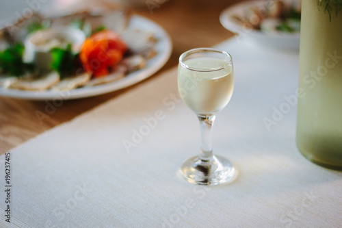 Ukranian gorilka - national alcohol drink in small glass. photo