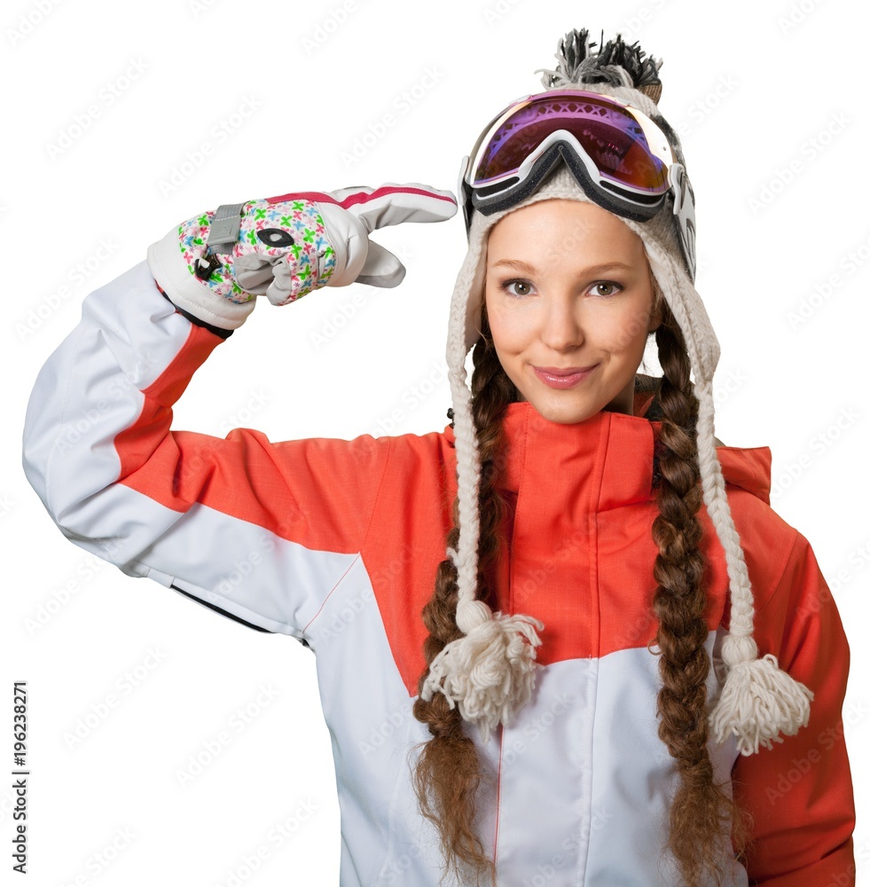 Female skiier holding her goggles Female skiier holding her goggles