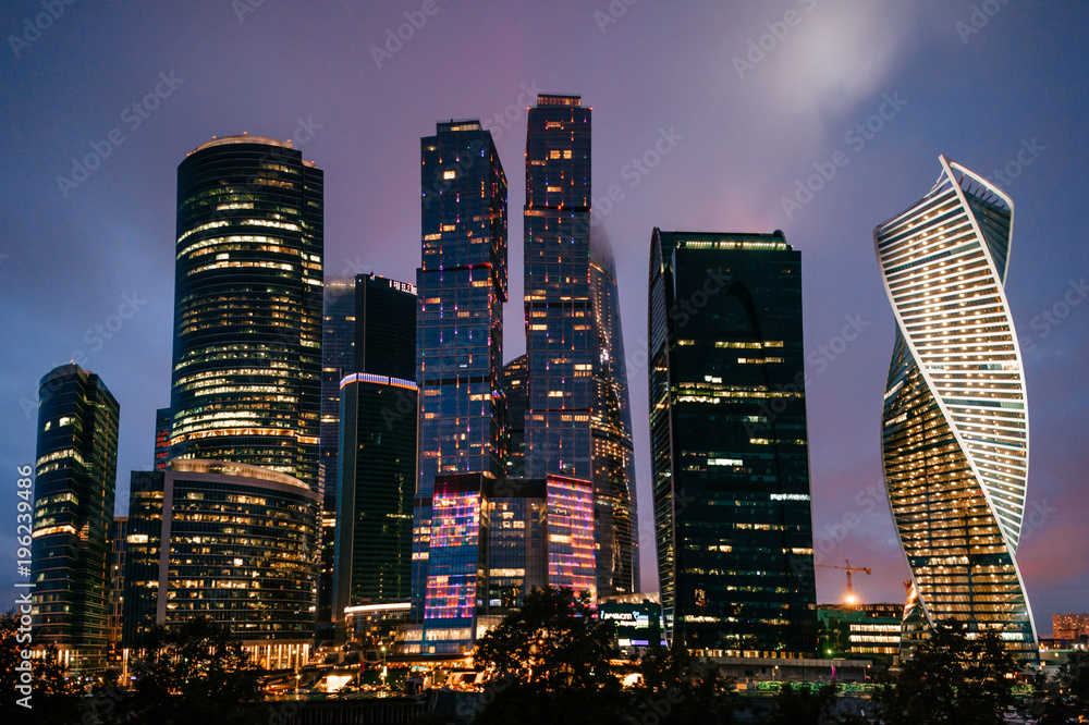 Moscow city towers in the night time. Business buildings.Beautiful futuristic city view. Famous touristic place in Russia. Archirecture skycrappers. Urban modern houses. International business center.