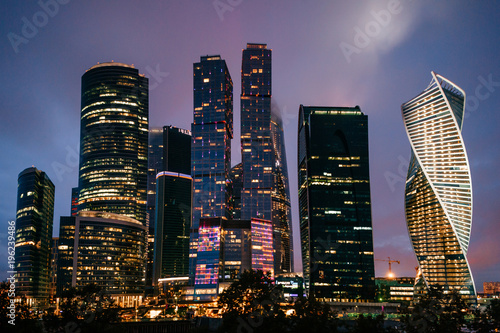 Moscow city towers in the night time. Business buildings.Beautiful futuristic city view. Famous touristic place in Russia. Archirecture skycrappers. Urban modern houses. International business center.