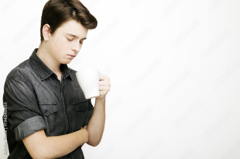 Coffee break. Confident young handsome man in jeans shirt Coffee break. Confident young handsome man in jeans shirt