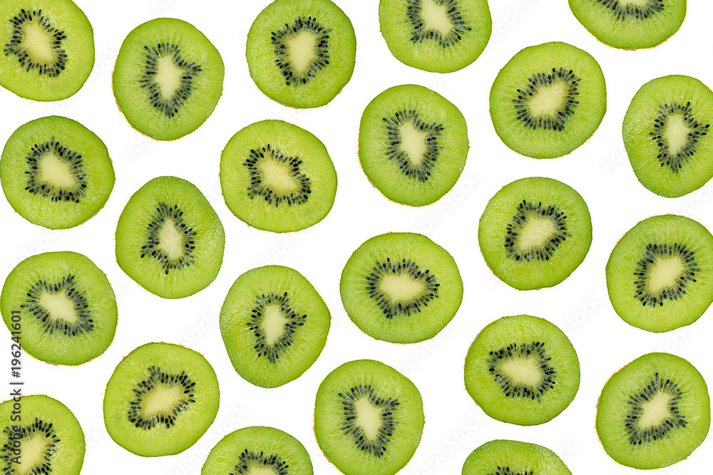 Fototapeta premium Green slices of kiwi fruit isolated on white background, overhead shot. Sliced kiwi photographic pattern, top view. Layout of sliced kiwi pieces on white backdrop. Kiwi seamless pattern.