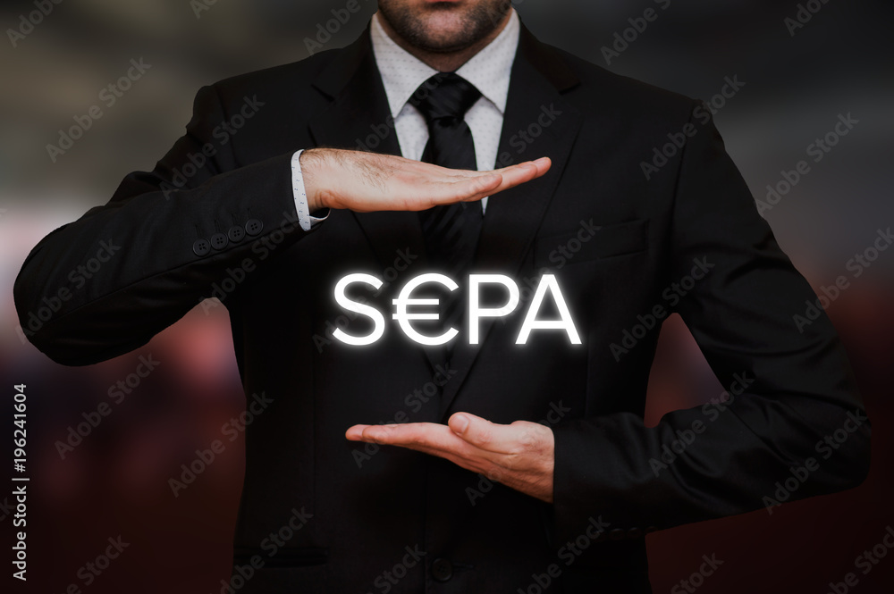 Businessman showing the text SEPA between his hands on blurry bokeh background Businessman showing the text SEPA between his hands on blurry bokeh background