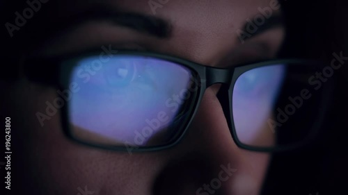 Wallpaper Mural woman with glasses eyes looking at the monitor, surfing the Internet, extreme close-up with reflection Torontodigital.ca