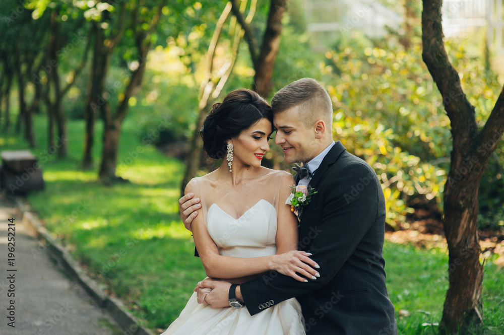 Sensual couple portrait, romantic newlywed bride and groom huggi Sensual couple portrait, romantic newlywed bride and groom huggi