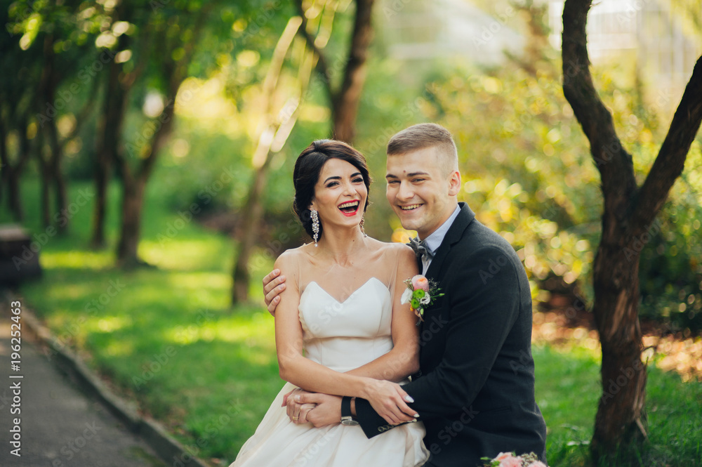 Sensual couple portrait, romantic newlywed bride and groom huggi Sensual couple portrait, romantic newlywed bride and groom huggi