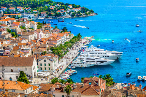 Hvar promenade aerial cityscape. / Aerial view at famous promenade in Hvar town, popular tourist resort in summertime.