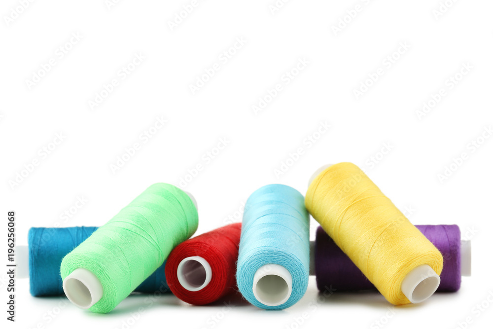 Colourful thread spools isolated on a white Colourful thread spools isolated on a white