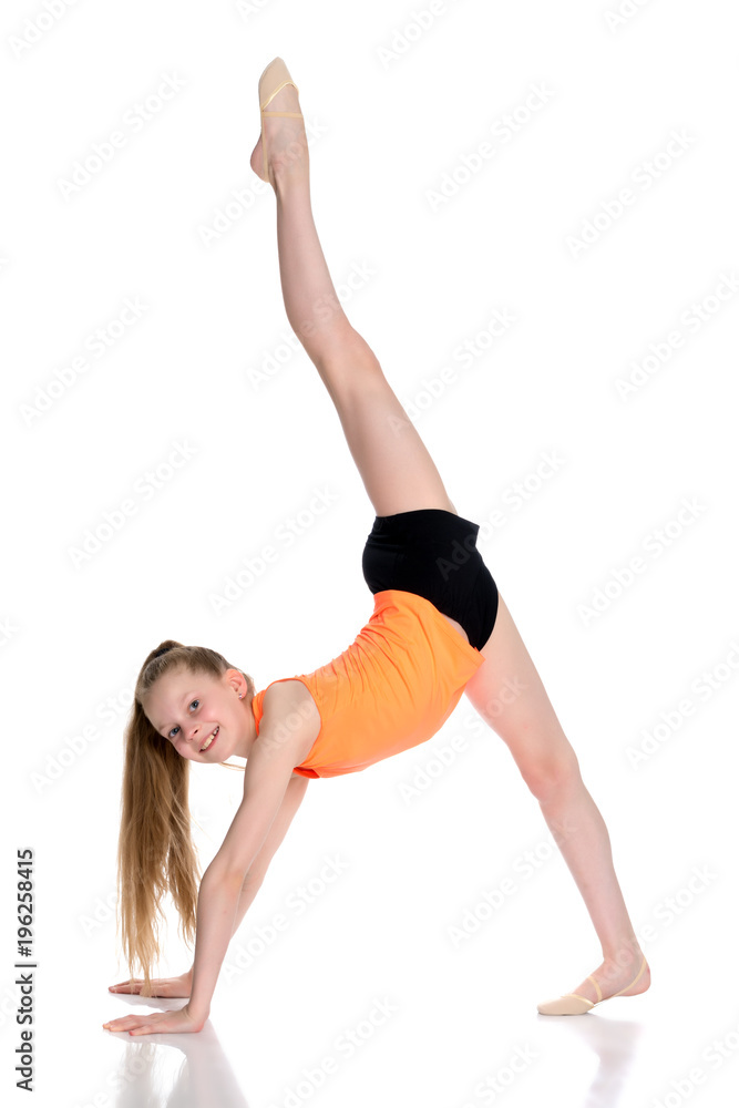 The gymnast perform an acrobatic element on the floor. The gymnast perform an acrobatic element on the floor.