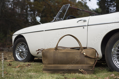 Bag next to sports car photo