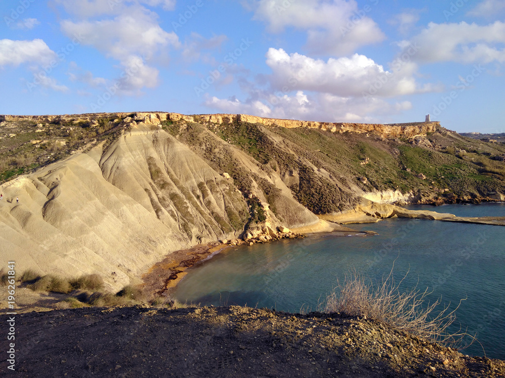 Comino island blue lagoon. Malta blue turquoise sea water beach. Rock and cliff sunny seashore. Travel mediterranean.