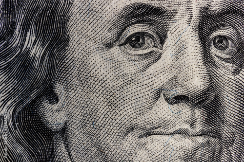 Closeup of Ben Franklin on a one hundred dollar bill for background IV photo