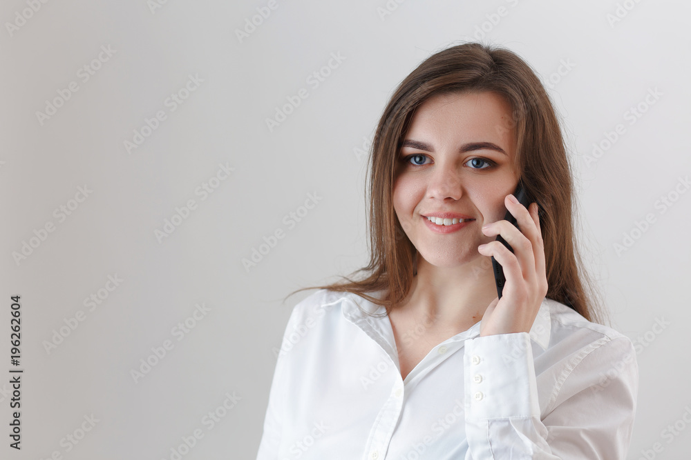 girl talking on the mobile, answering the call on the cell phone girl talking on the mobile, answering the call on the cell phone