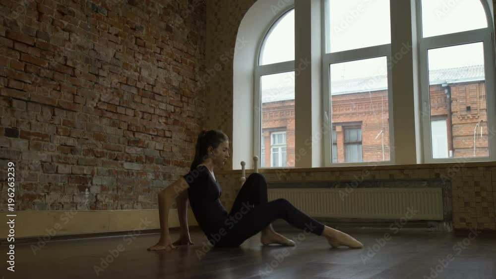 sport fitness. gymnast training. flexibility workout. young fit teenage girl stretching in a gym sport fitness. gymnast training. flexibility workout. young fit teenage girl stretching in a gym
