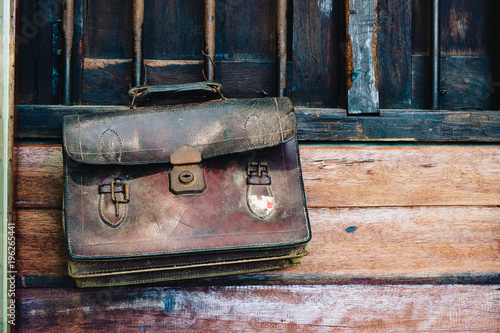 Old vintage retro antique brown leather student handback or schoolbag , Back to school background vintage retro tone concept. © ezstudiophoto
