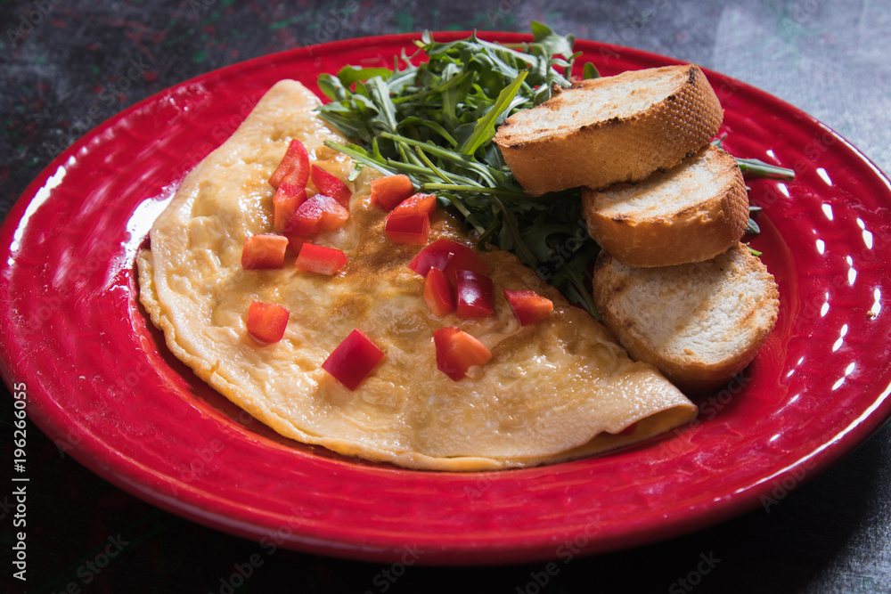 Omelet, fried chicken eggs with fresh vegetables Omelet, fried chicken eggs with fresh vegetables