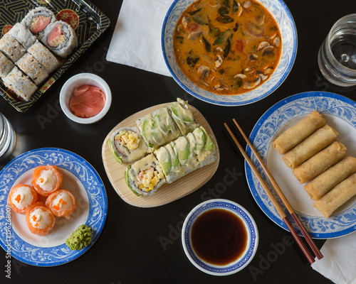 Soup, spring rolls, and sushi rolls