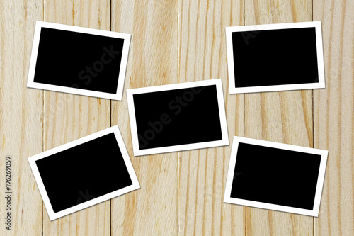 Photo frame blank on wood background with space
