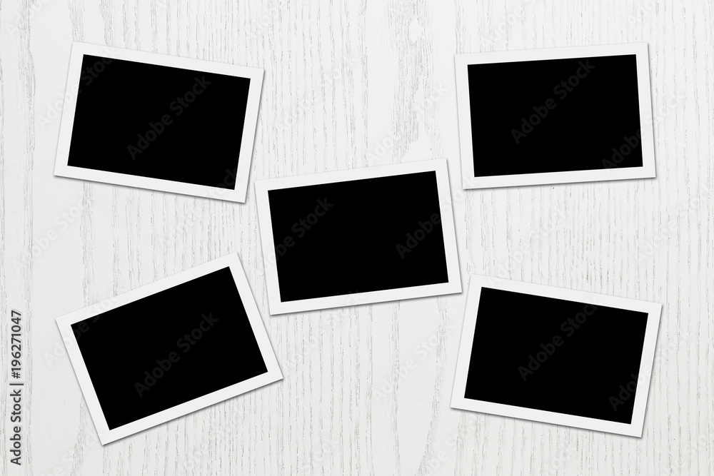 Blank photos on white plank Blank photos on white plank