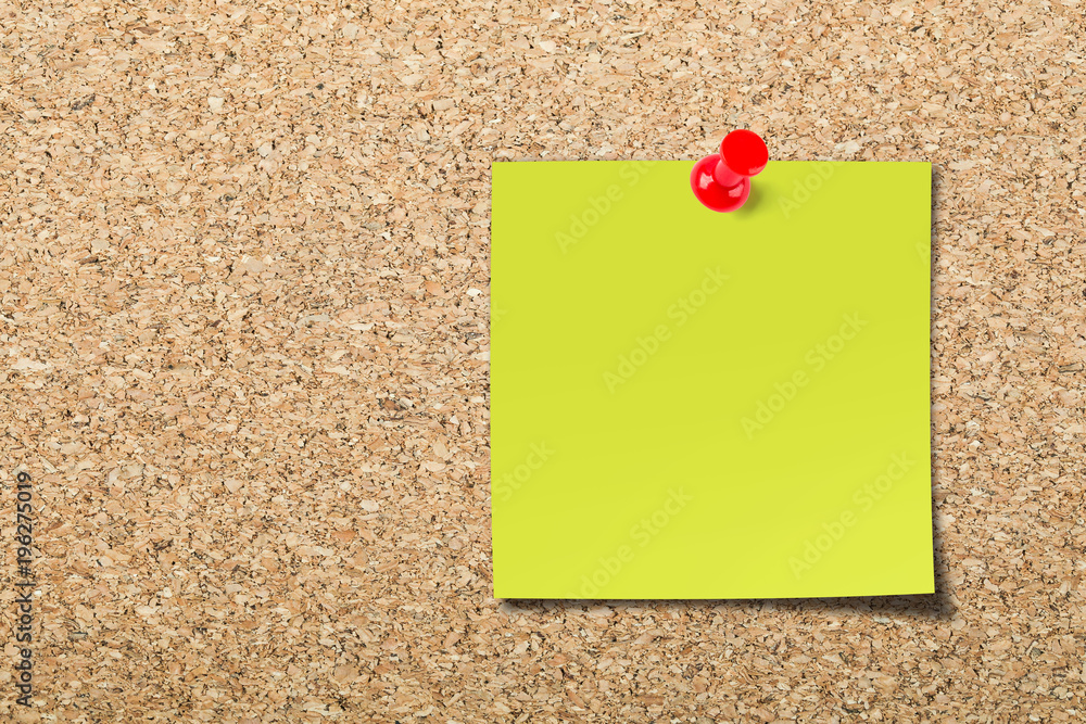 Blank sticky note on cork board Blank sticky note on cork board