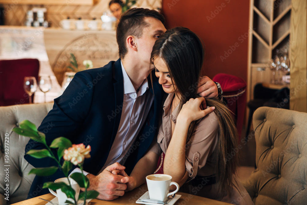 Happy young couple taking selfie with smart phone at cafe Happy young couple taking selfie with smart phone at cafe