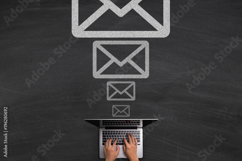 Email Concept With Laptop On Blackboard