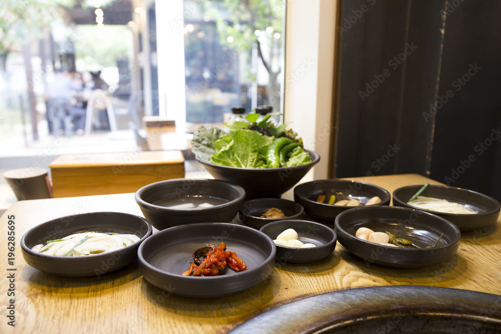 Korean Set Table with various side dish, vegetable, jeotgal, picked garic & chili Korean Set Table with various side dish, vegetable, jeotgal, picked garic & chili