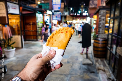 meat pastry in market, hand held