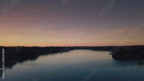 An slow-moving aerial drone shot of Lake Oconee at sunset.'[7