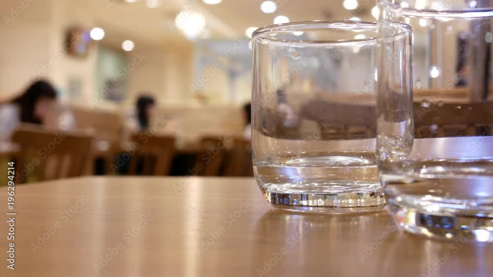Motion of people drinking water with blur people eating foods inside Japanese restaurant with 4k resolution. Motion of people drinking water with blur people eating foods inside Japanese restaurant with 4k resolution.