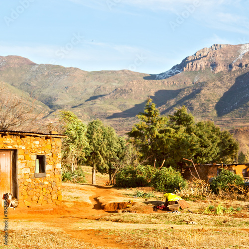  in lesotho street village near mountain