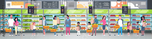 Group Of People In Supermarket Holding Bags, Baskets And Pushing Trolleys Over Shelves With Grocery Products Consumerism Concept Flat Vector Illustration