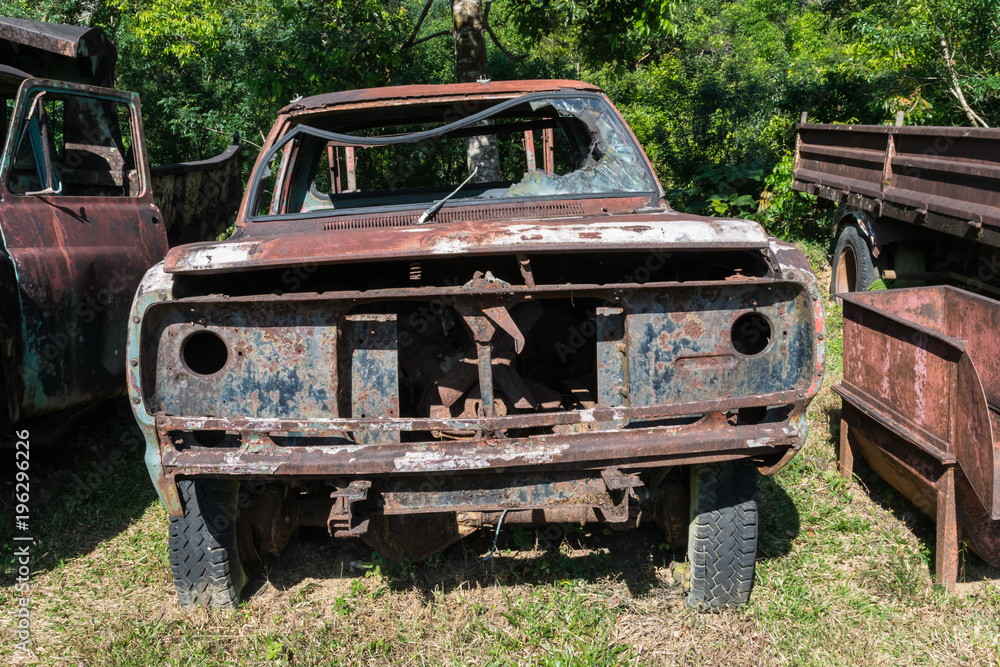 The rusty old car of Pilok old mining in E-Thong village, Pilok,Thong Pha Phum National Park, Kanchanaburi province, Thailand. The rusty old car of Pilok old mining in E-Thong village, Pilok,Thong Pha Phum National Park, Kanchanaburi province, Thailand.