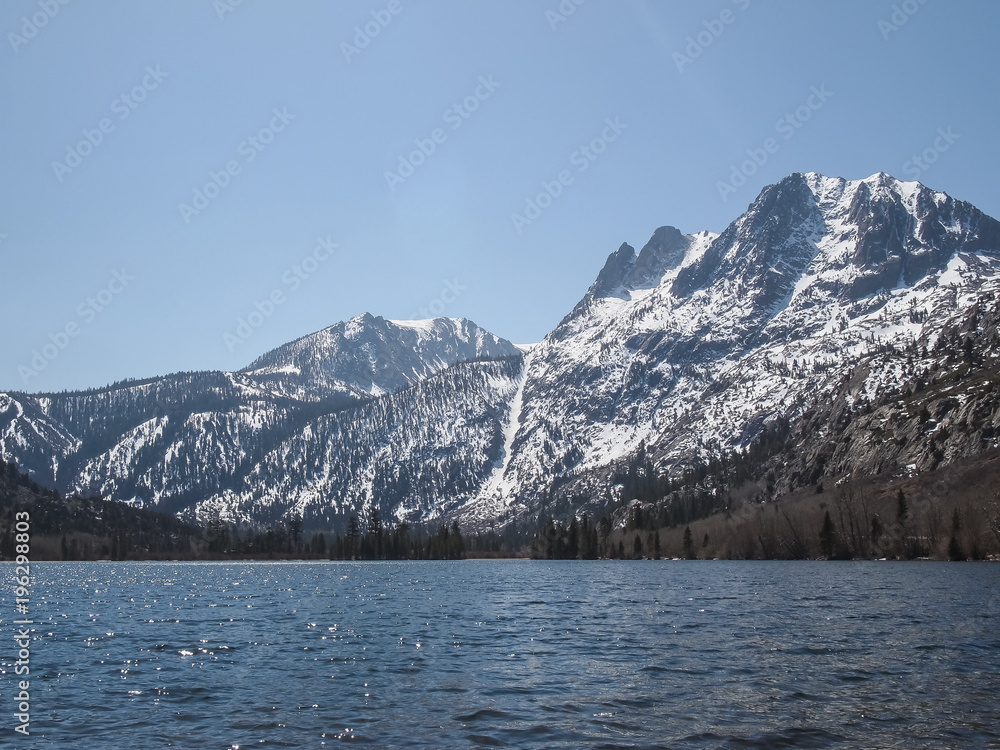 Beautiful lake, snow mountain and pine tree Beautiful lake, snow mountain and pine tree