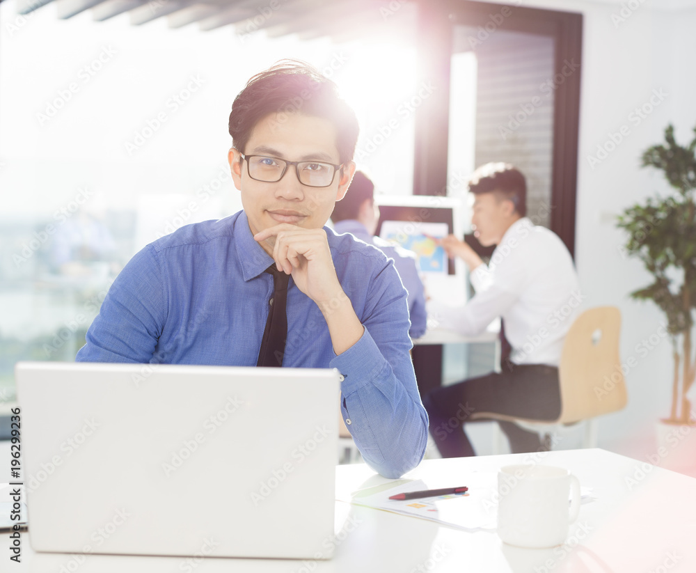 young business man work in office on computer young business man work in office on computer