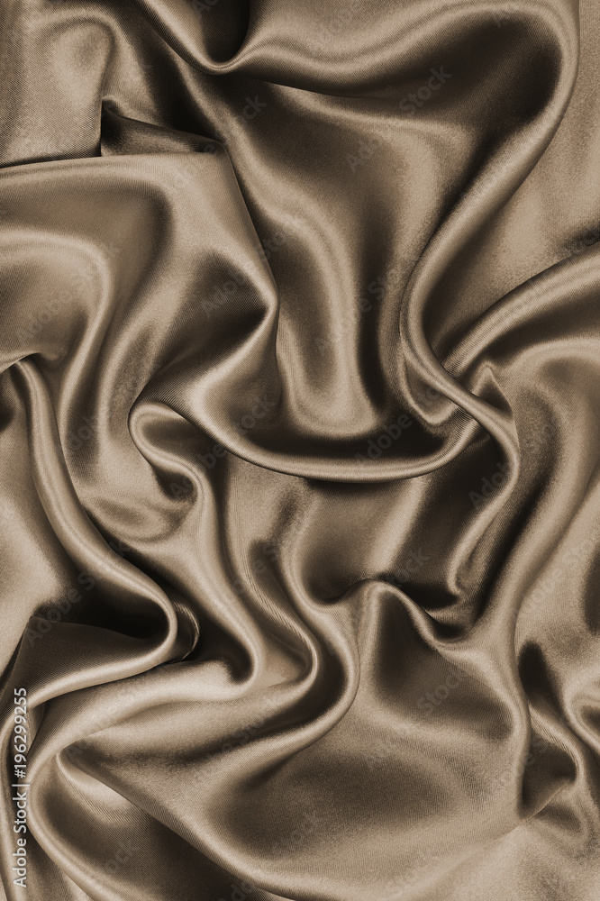 Obraz premium Smooth elegant brown silk or satin texture as abstract background. Luxurious background design. In Sepia toned. Retro style