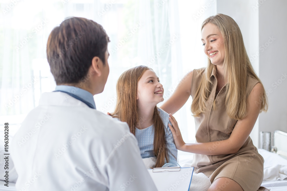 Fototapeta premium Doctor visit to little patient at hospital with happy emotion together. People with health care and medical concept.