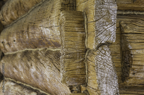 Wooden restored barn. Built in the 18th century. A log wall and a corner joint of logs. Interesting photo for the site about construction, history.