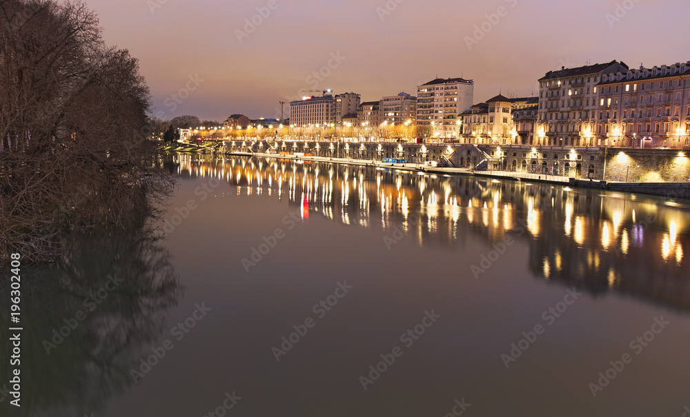 Po river flowing in Torino city, Italy, Murazzi docks, night view