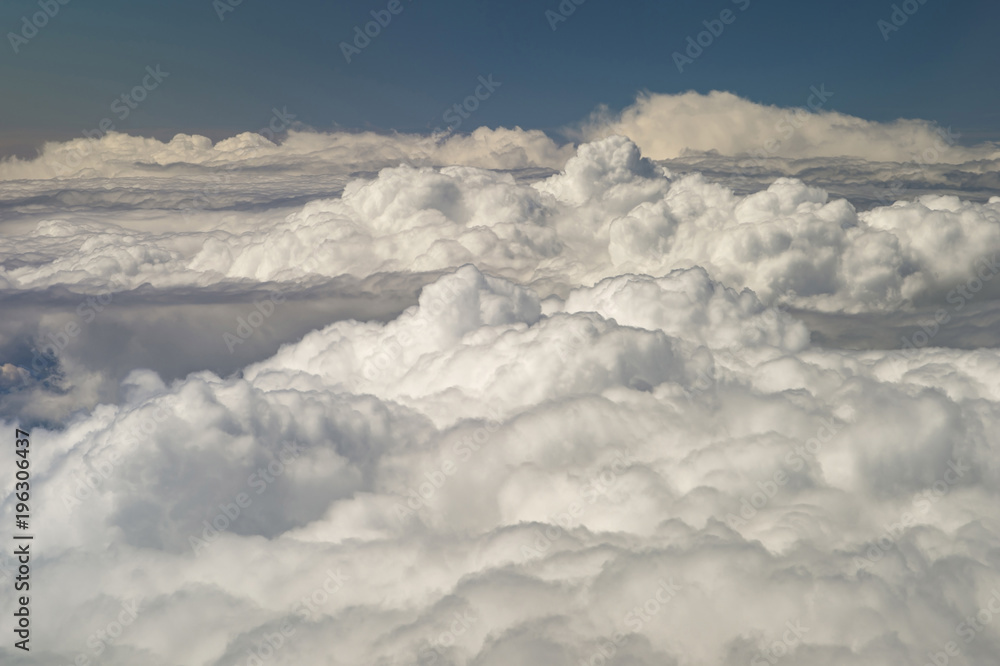 The top view on clouds from an airplane window The top view on clouds from an airplane window