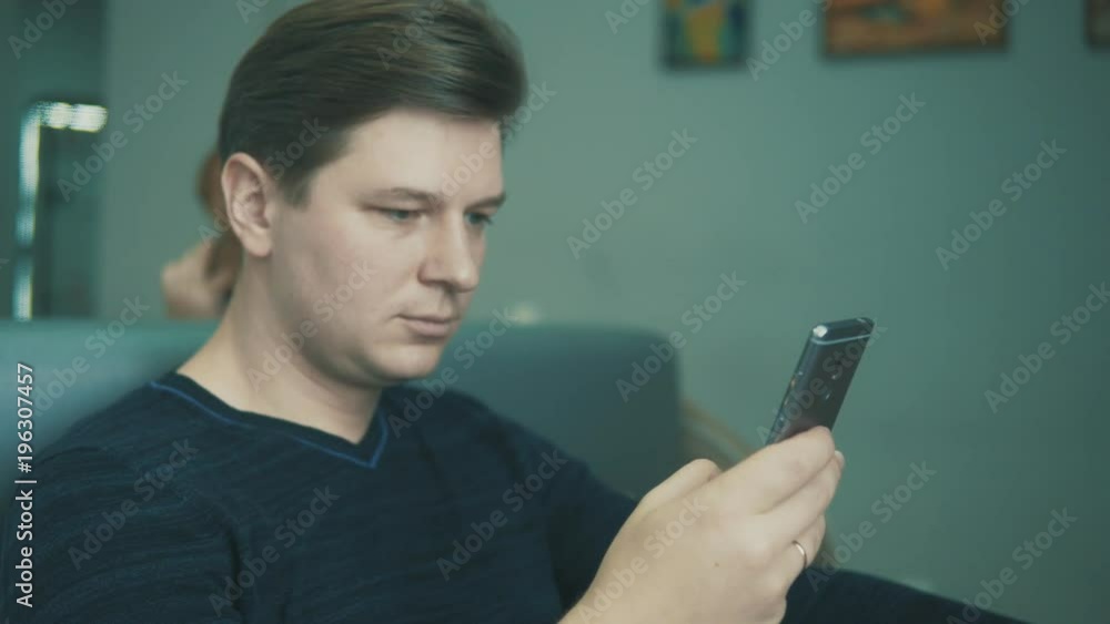 man uses a mobile phone in a cafe man uses a mobile phone in a cafe