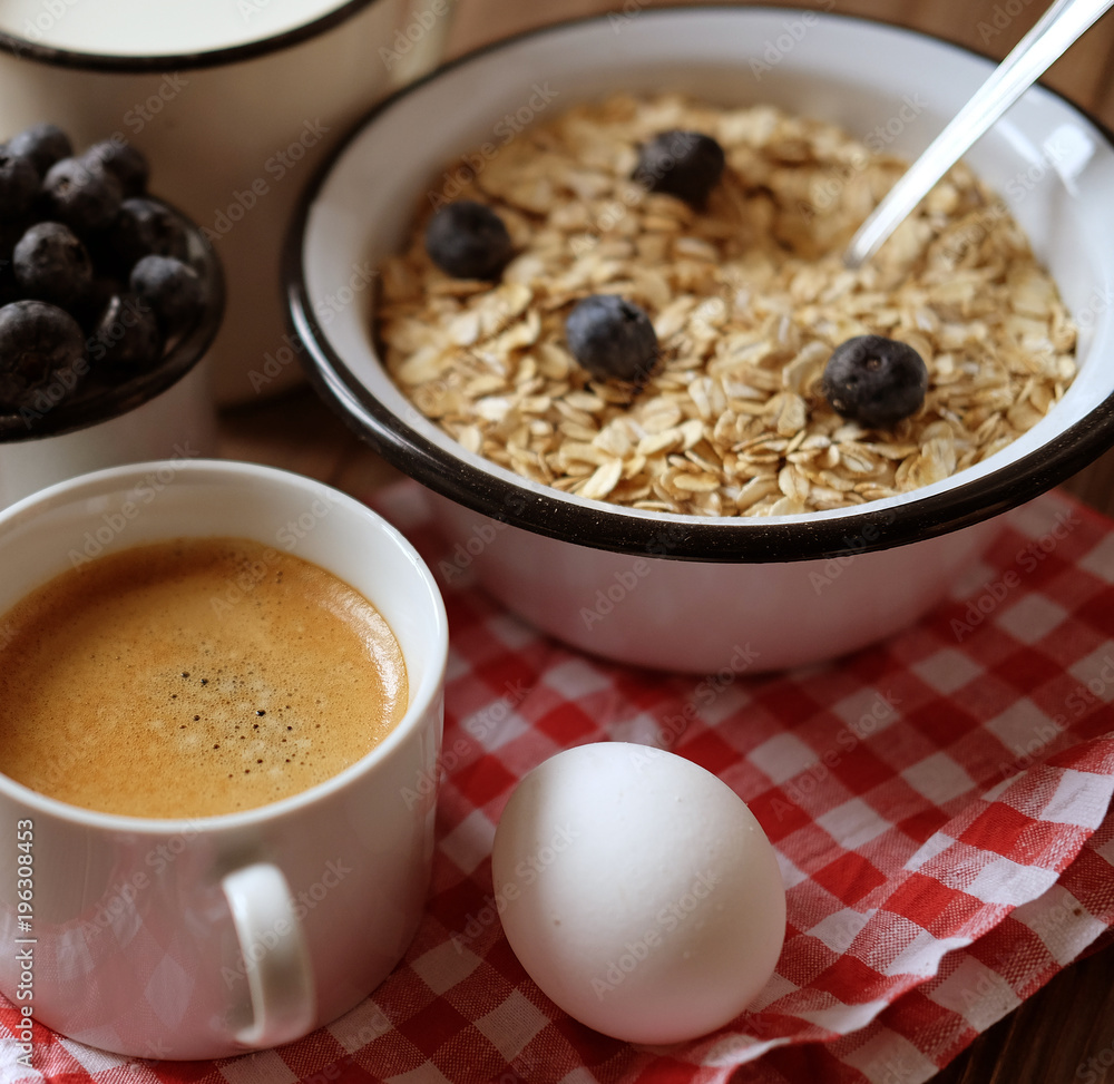 healthy eating and diet concept: oatmeal, boiled egg, milk, fres healthy eating and diet concept: oatmeal, boiled egg, milk, fres