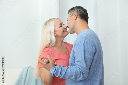 Happy mature couple dancing...