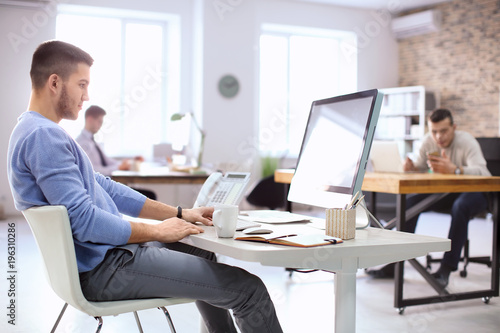 Young man working in office