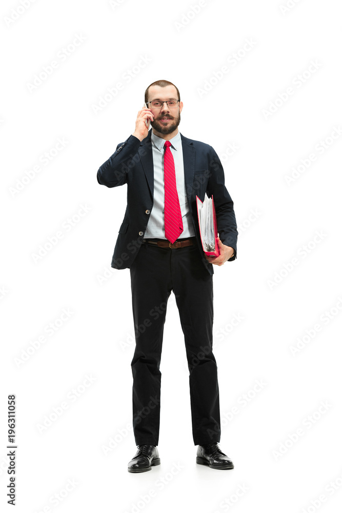 Happy businessman talking on the phone with folder in hand isolated over white background in studio shooting Happy businessman talking on the phone with folder in hand isolated over white background in studio shooting